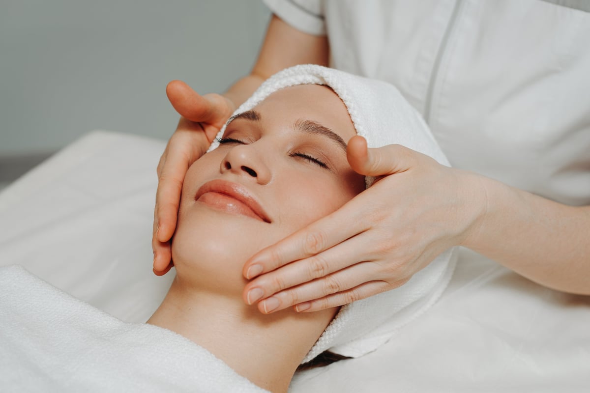 Facial spa treatment relaxing skincare beauty salon wellness woman receiving massage